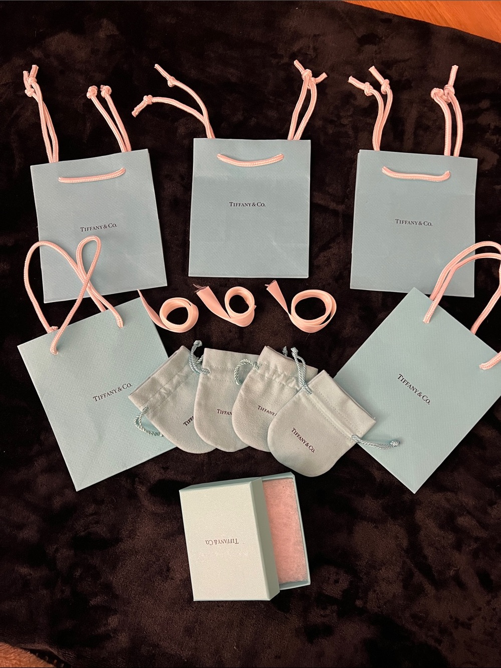 Tiffany & Co. light blue and pink gift bags with drawstring pouches